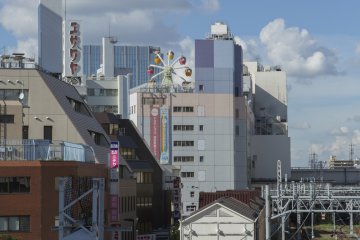 Tokyu Plaza rises above Kamata station with Ferris wheel in sight