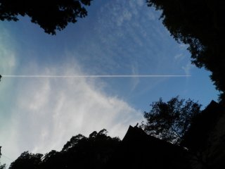 Jet trails across an evening sky.