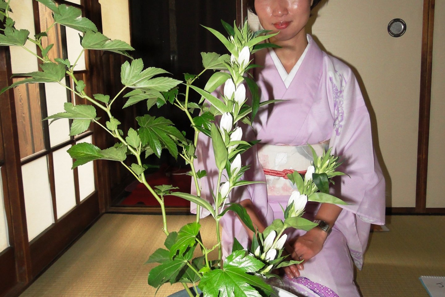 Kimiko Yamamoto teaches ikebana to travelers in Kyoto