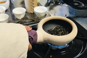 Roasting the tea in the ceramic pot