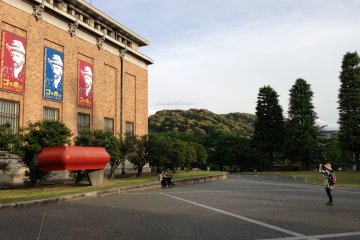 <p>Kyoto Municipal Museum of Art is surrounded by tree lined canals and parklands</p>