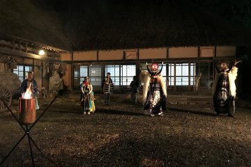 Experience the local Shishi Dance outside an old farmhouse by night. 