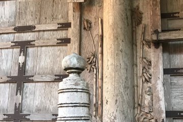 Some wood carvings on the shrine and a metal sword. What does it mean?