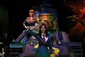 What war game would be complete without girls draped on a tank?
