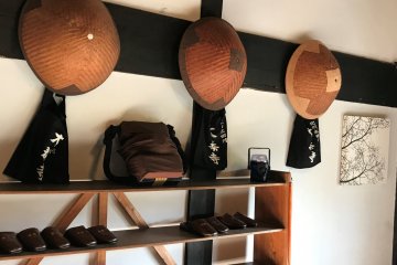 Zen monk hats and bags at the entrance