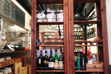 <p>Via Quadronno looks like an Italian Kitchen with flour covered cookbooks and half opened bottles of chianti in the cupboard</p>