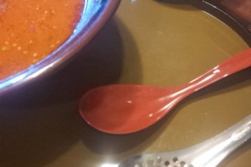 A spoon with holes in