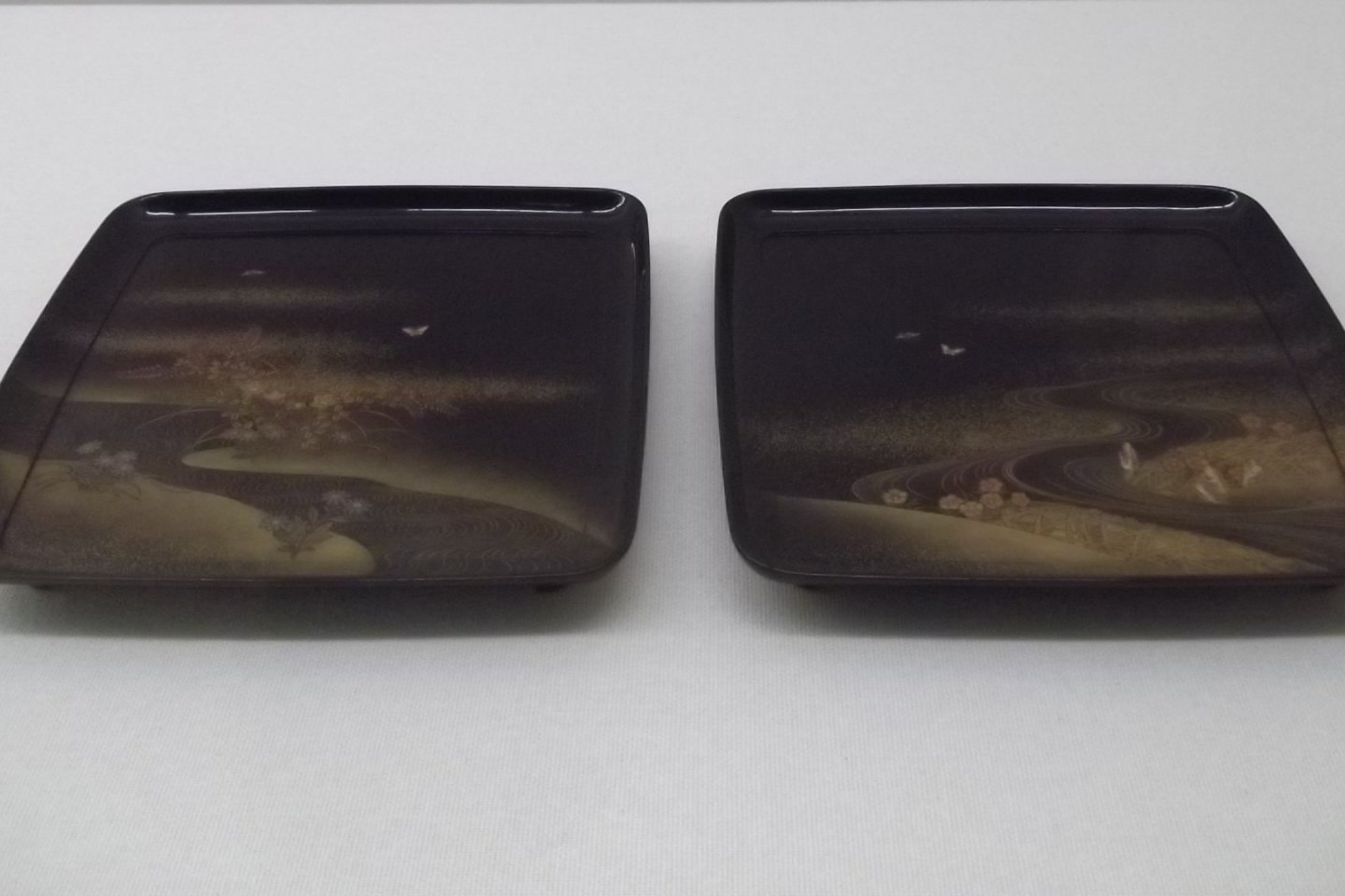 A pair of lacquered plates