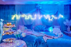Seashell cushions and sparkly mermaid tail blankets add to the under the sea feel