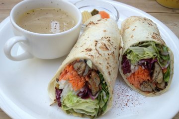 Veggie wrap with soup and pickles