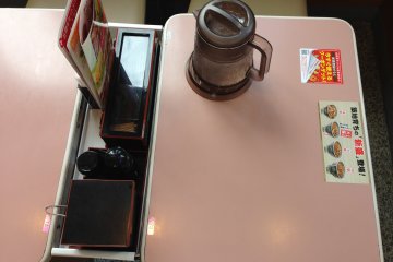 <p>Take a seat inside Yoshinoya and look over the menu as orders are now taken from the table unless taking food to go</p>