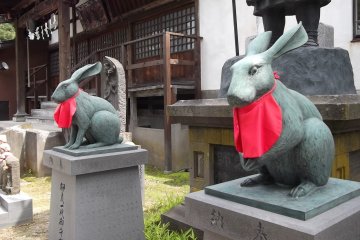 Some temples have lion guardians; this one has rabbits