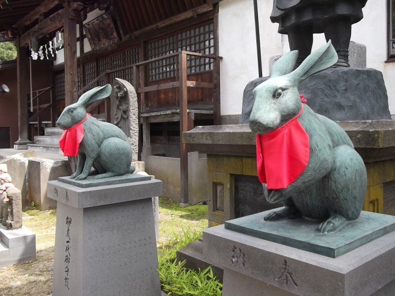 Some temples have lion guardians; this one has rabbits