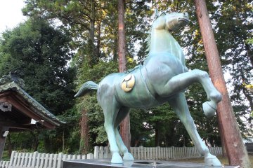 A beautiful horse, God's servant, dominates the grounds