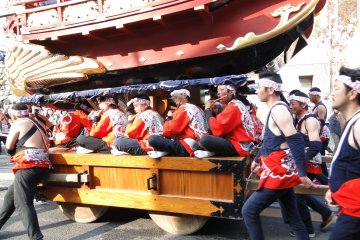 Musicians sitting on the float's base