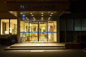 Sunhotel Tosu, main entrance at night