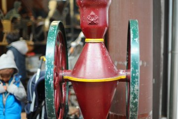 <p>The vintage coffee mill outside the store</p>