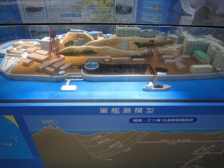There is a model 'Gunkanjima' displayed inside the Terminal Building