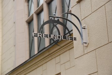 <p>The sign outside Freundlieb&nbsp;Cafe</p>
