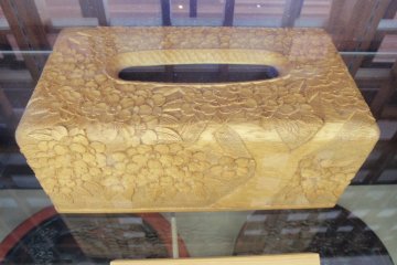 <p>Carved wooden tissue holder</p>
