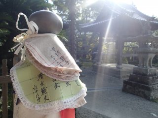 Bibs tied around temple posts to pray for the safety of a child