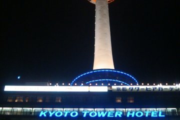 <p>Kyoto Tower Hotel neon sign below the tower itself.&nbsp;</p>