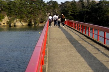 <p>The long bright red foot bridge that connects Fukuurajima to the ticket office and the mainland.</p>