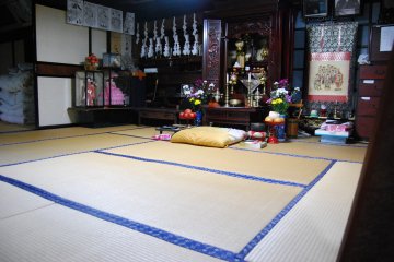 <p>A traditional buddhist altar (butsudan) set in a tatami room.</p>