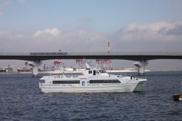 <p>The ferry setting off for Kansai International Airport, with the PortLiner&nbsp;in the background on its way into Kobe</p>