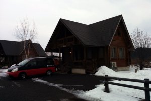 Log houses have six beds and are two stories. There is room to park your car at the log house for unloading or use the free 150 car parking lot.