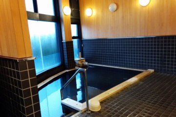 <p>The onsen doesn&#39;t offer much of a view, but it seems new and is clean. The wood gives off a wonderful aroma when it meets the hot steam.</p>