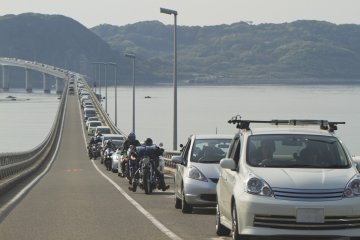 Tsunoshima Bridge at 4 pm on a spring holiday; you might want to have that sunset picnic on the island after all